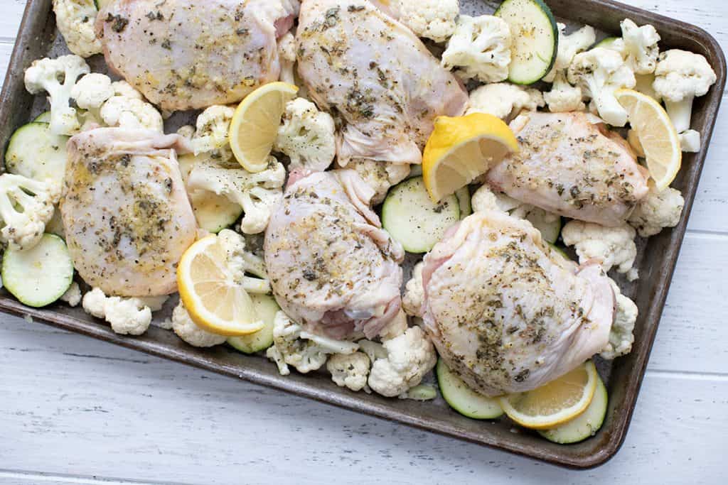 Top down image of keto sheet pan chicken before being cooked.