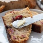 Titles image of a knife spreading butter on a slice of keto Irish soda bread.