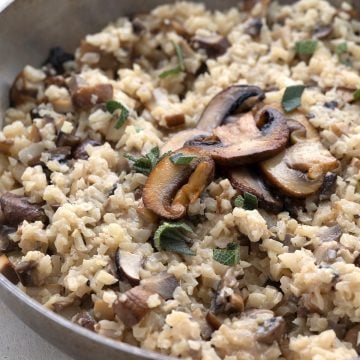 Close up shot of keto mushroom risotto with cauliflower rice.