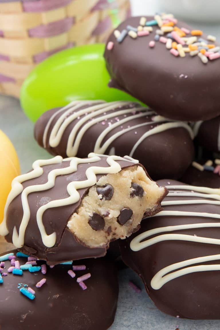 Close up shot of a keto cookie dough easter egg bitten open to show the inside.