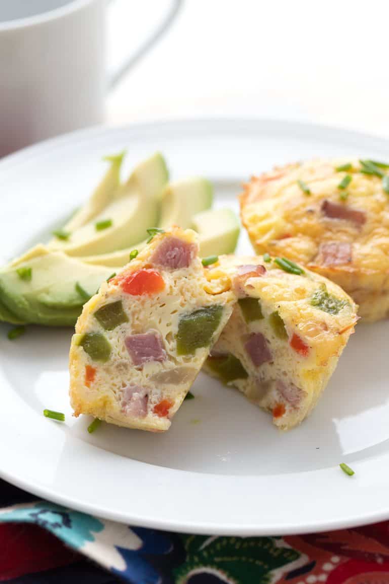 Close up shot of a Denver omelet egg muffin cut open to show the inside.