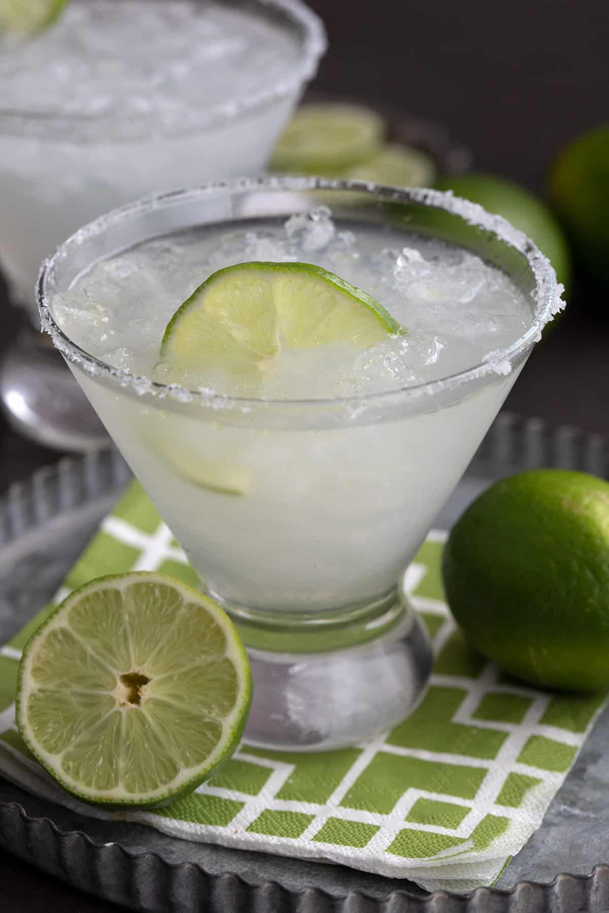 Close up shot of a keto margarita with a slice of lime floating in it.