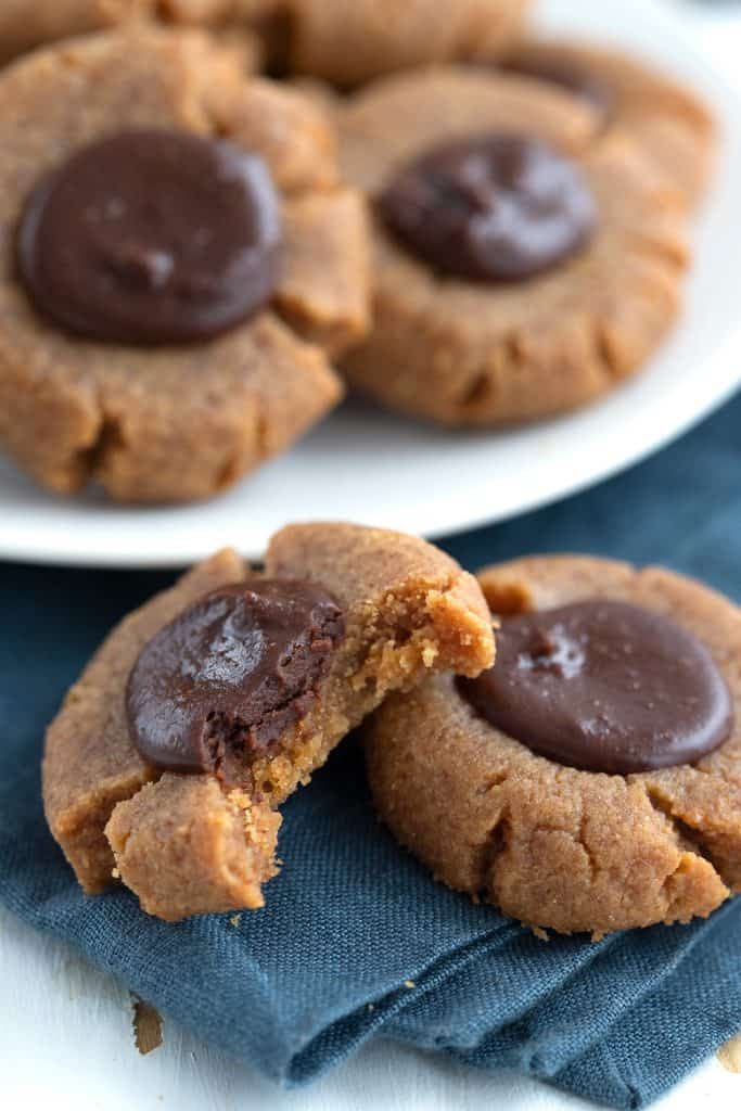 Keto peanut butter thumbprints filled with sugar free Nutella.