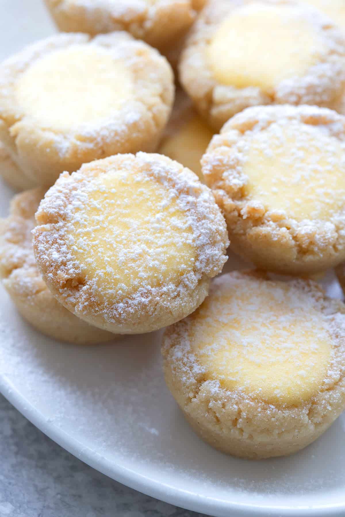 Close up shot of keto lemon bar cookies on a white plate.