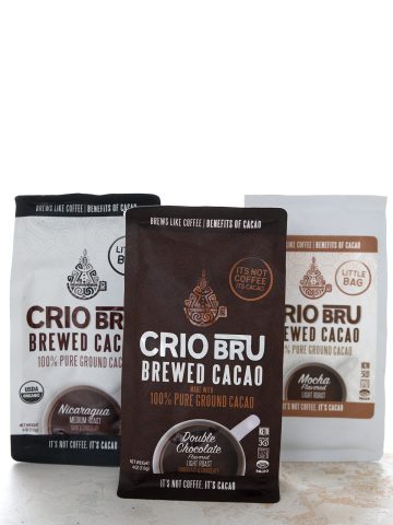 Three bags of Crio Bru Cacao on a white table.