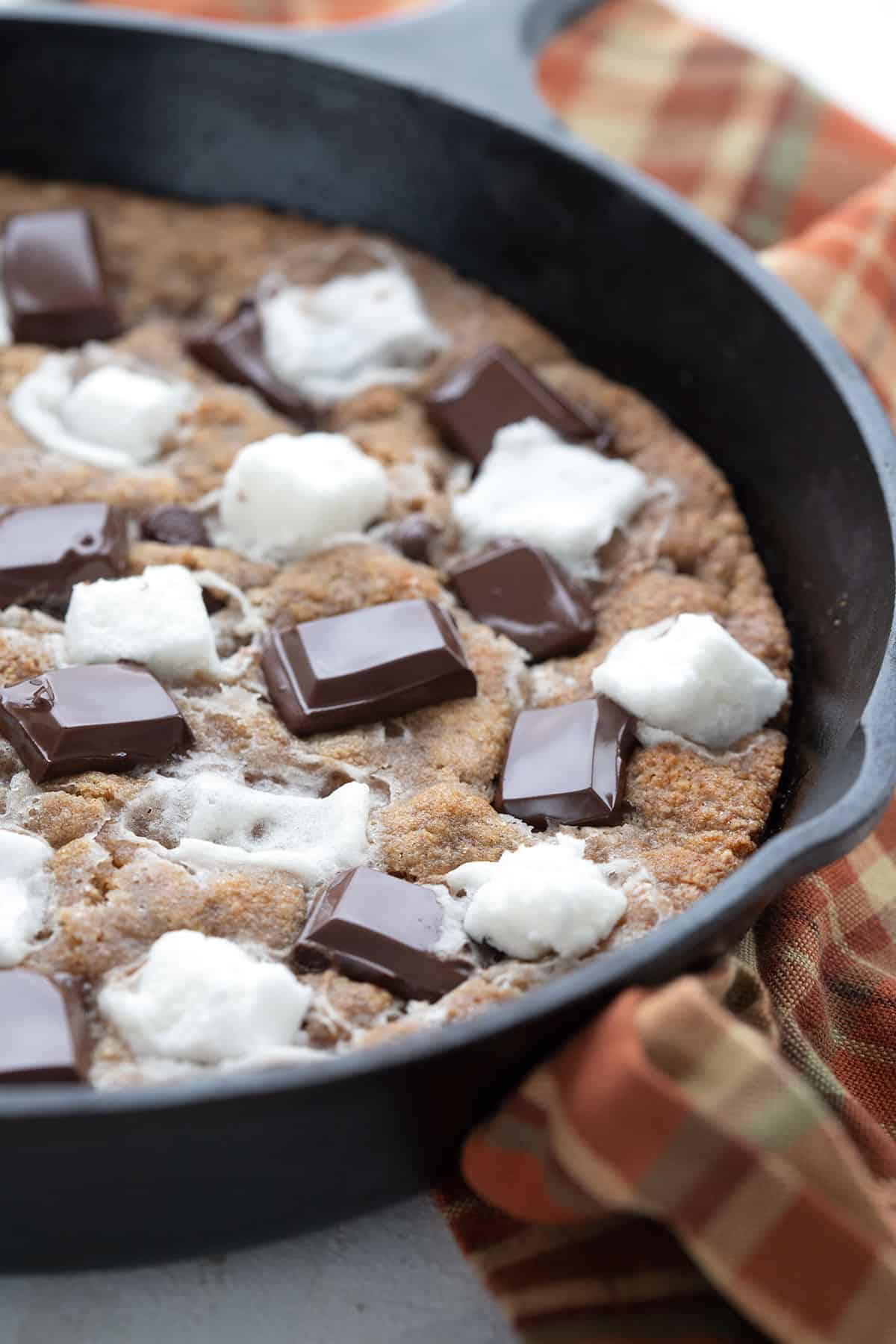 Close up shot of sugar-free chocolate on a keto skillet cookie.