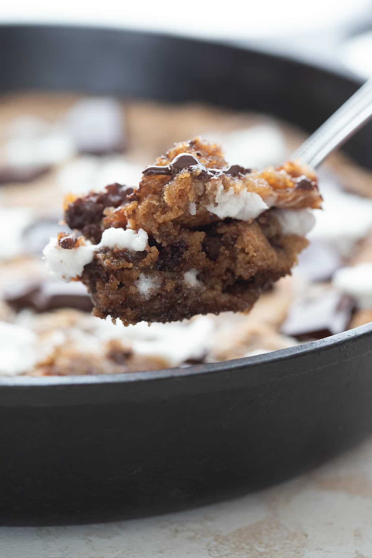 Close up shot of a spoonful of keto smores skillet cookie.