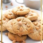 Keto Butterscotch Chip Cookies piled up on a white plate with a cup of coffee in the background.