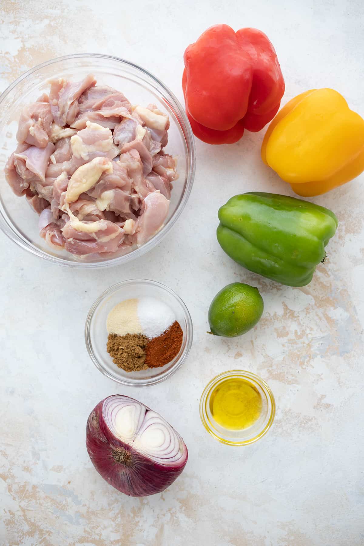Top down image of ingredients for Chicken Fajita Kebobs.
