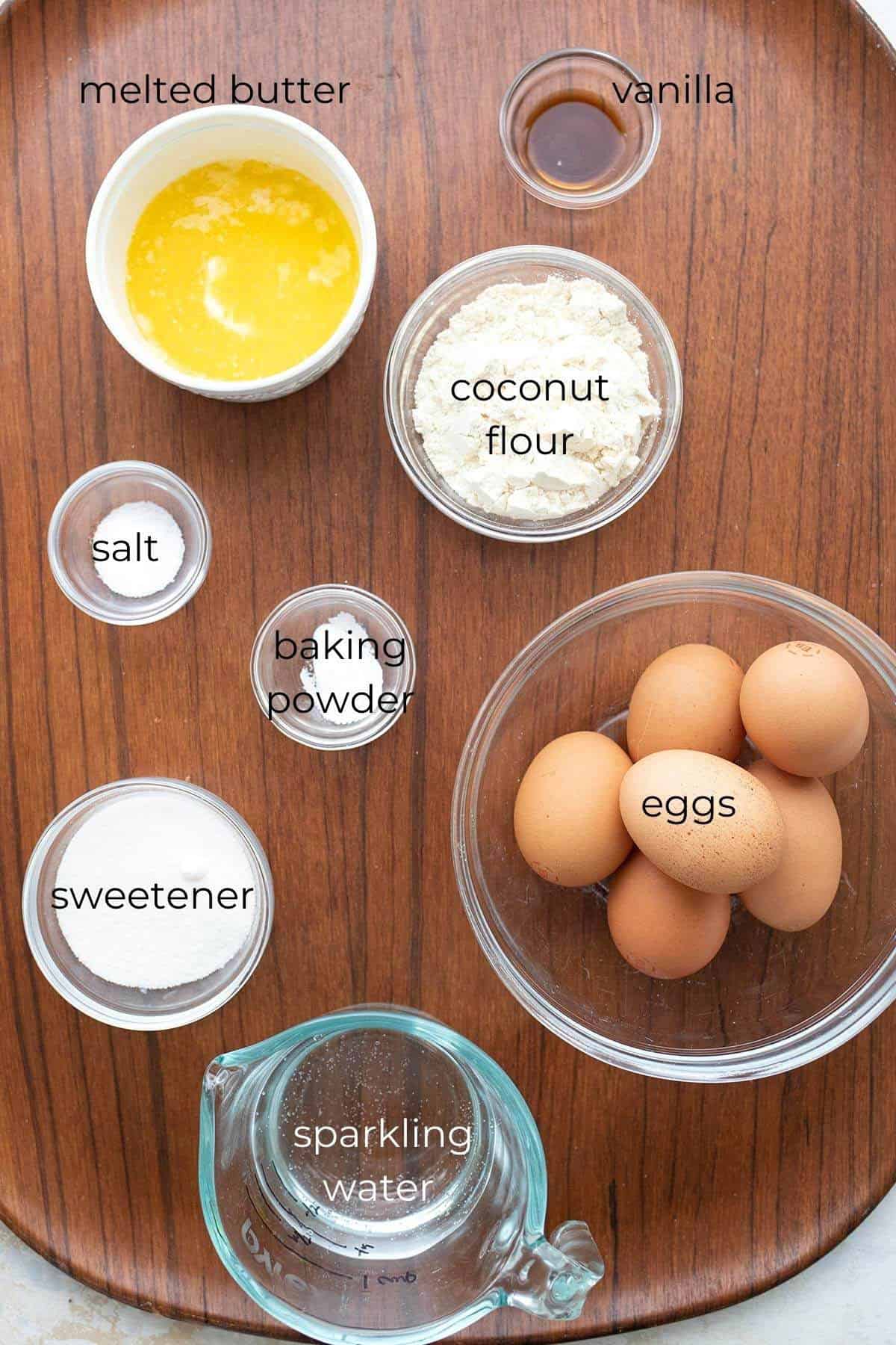 Top down image of labeled ingredients for keto coconut pancakes.