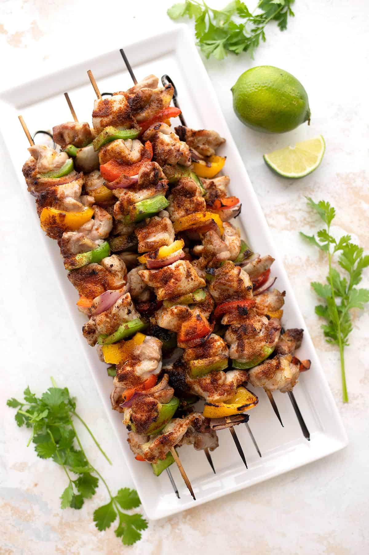 Top down image of a platter of Keto Chicken Fajita Kebabs.