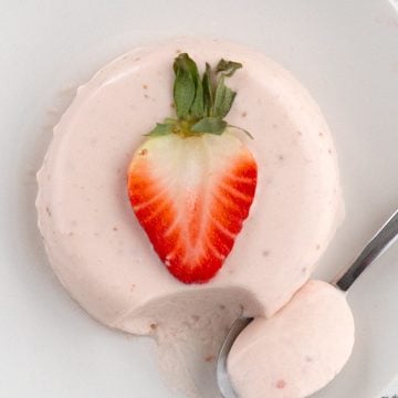Top down image of Keto Strawberry Panna Cotta with a strawberry on top.