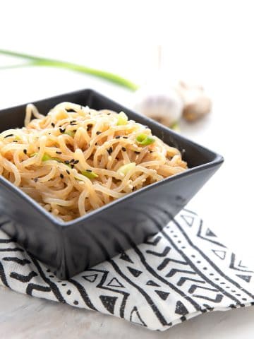 A black square dish filled with keto sesame noodles.