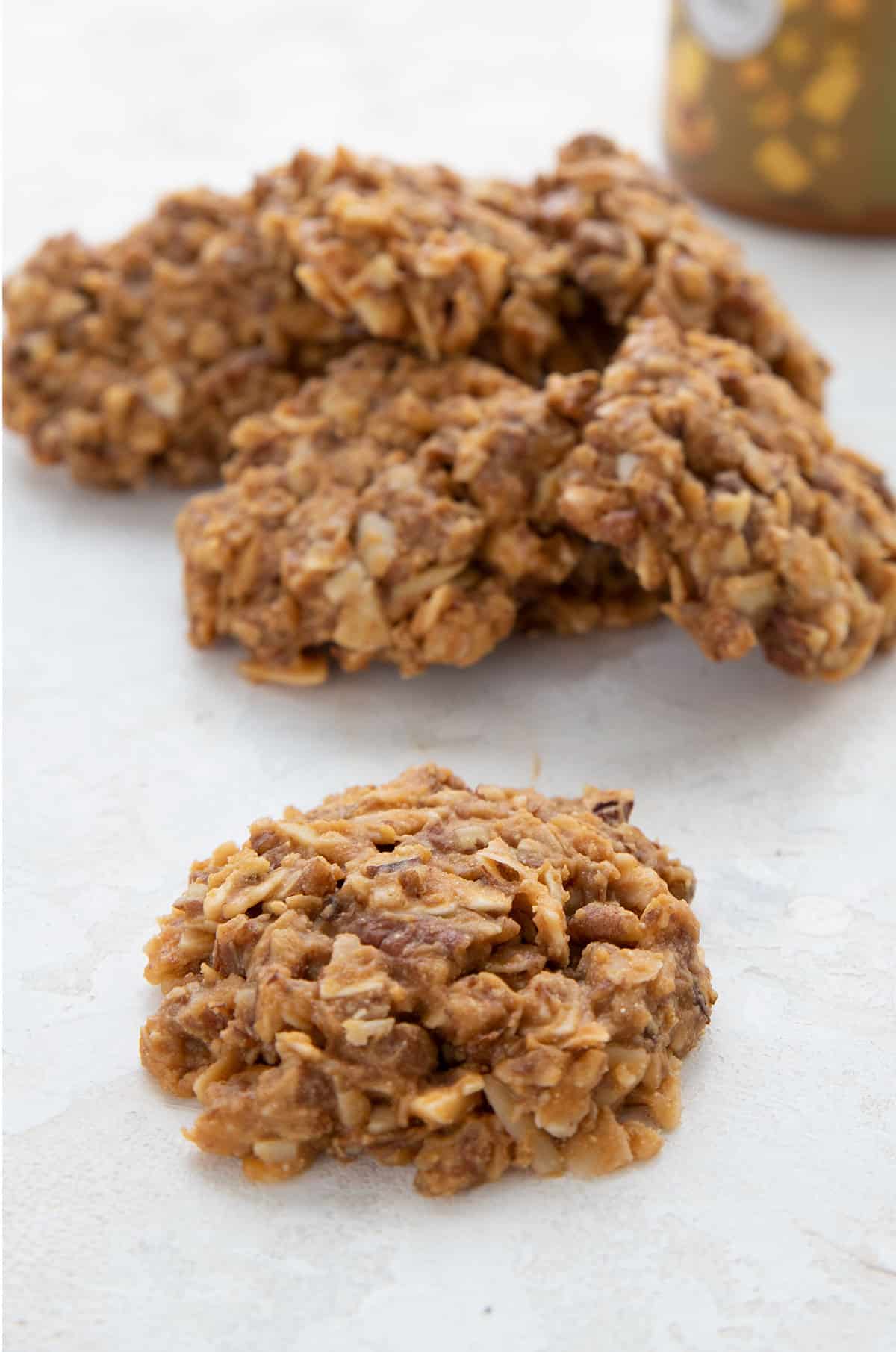 A Keto No Bake Cookie in front of a pile of more keto cookies.