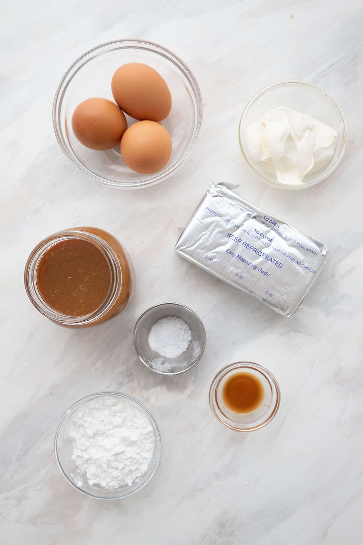 Top down image of the ingredients for Dulce de Leche Cheesecake.