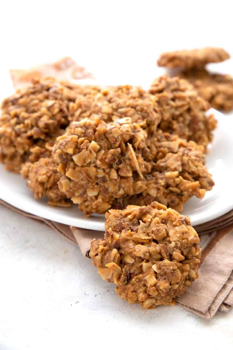 A white plate full of Keto No Bake Cookies on a tan napkin.