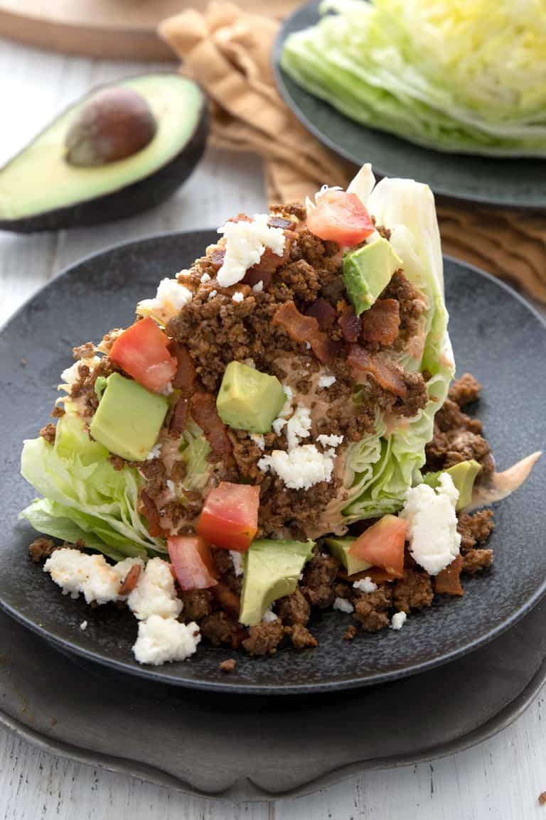 Close up shot of a Keto Taco Salad on a black plate.