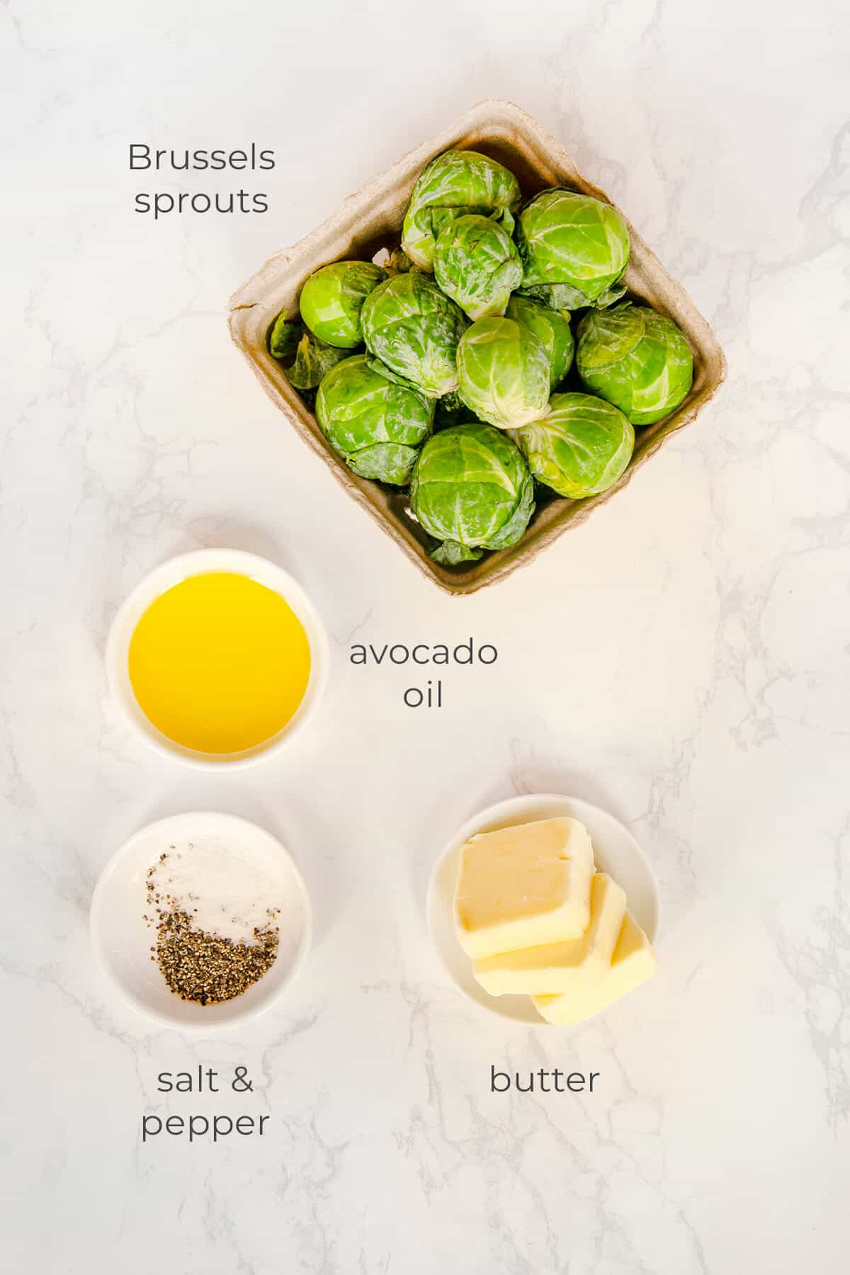 Top down image of ingredients labeled and needed to make caramelized Brussels sprouts