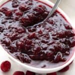 Titled image of a white oval dish filled with sugar-free cranberry sauce.