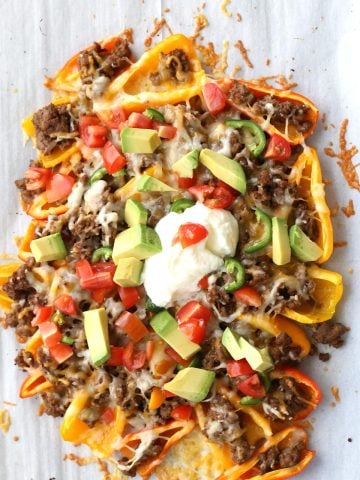 Top down image of keto nachos made with mini peppers.