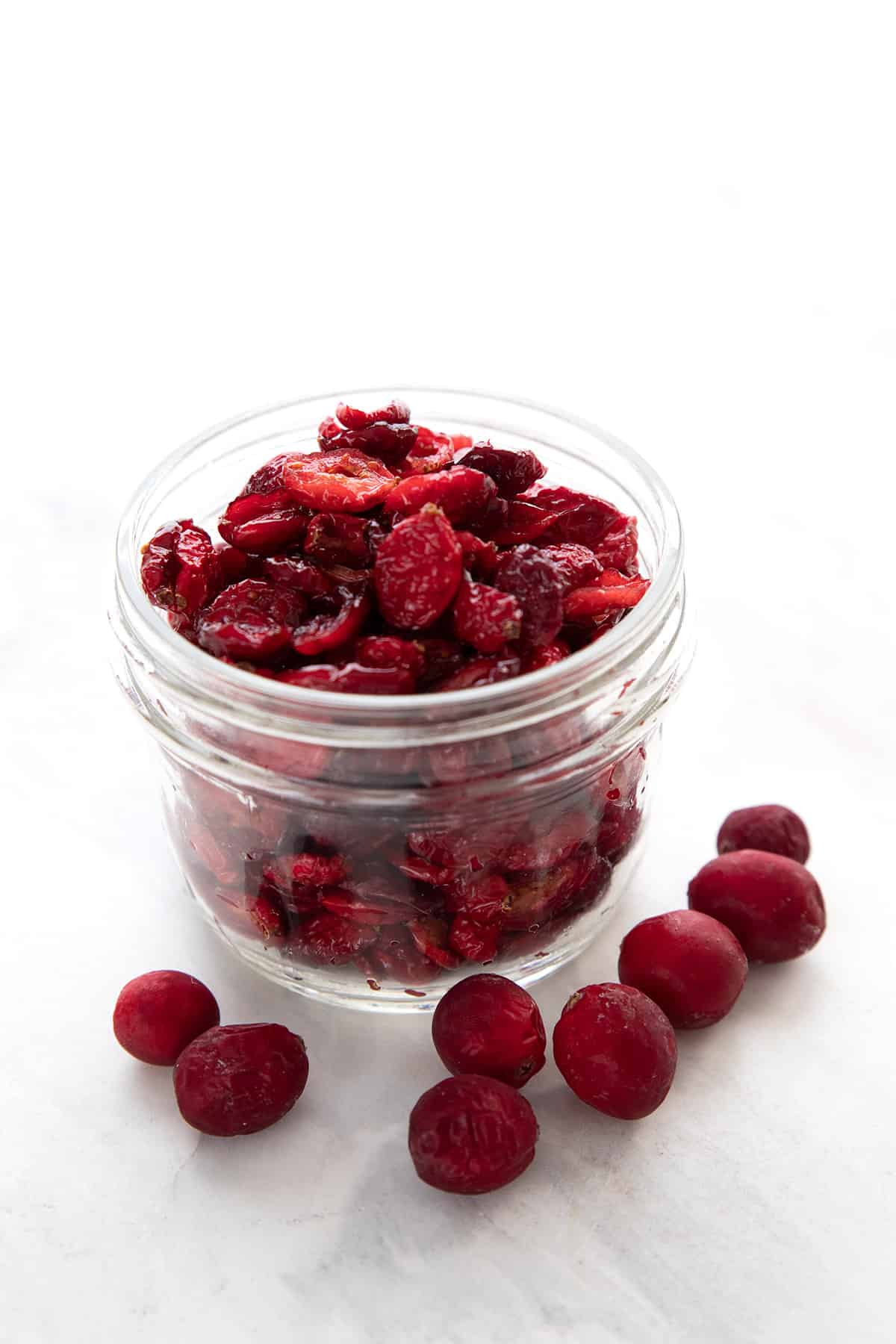 A jar of homemade dried cranberries with no added sugar.