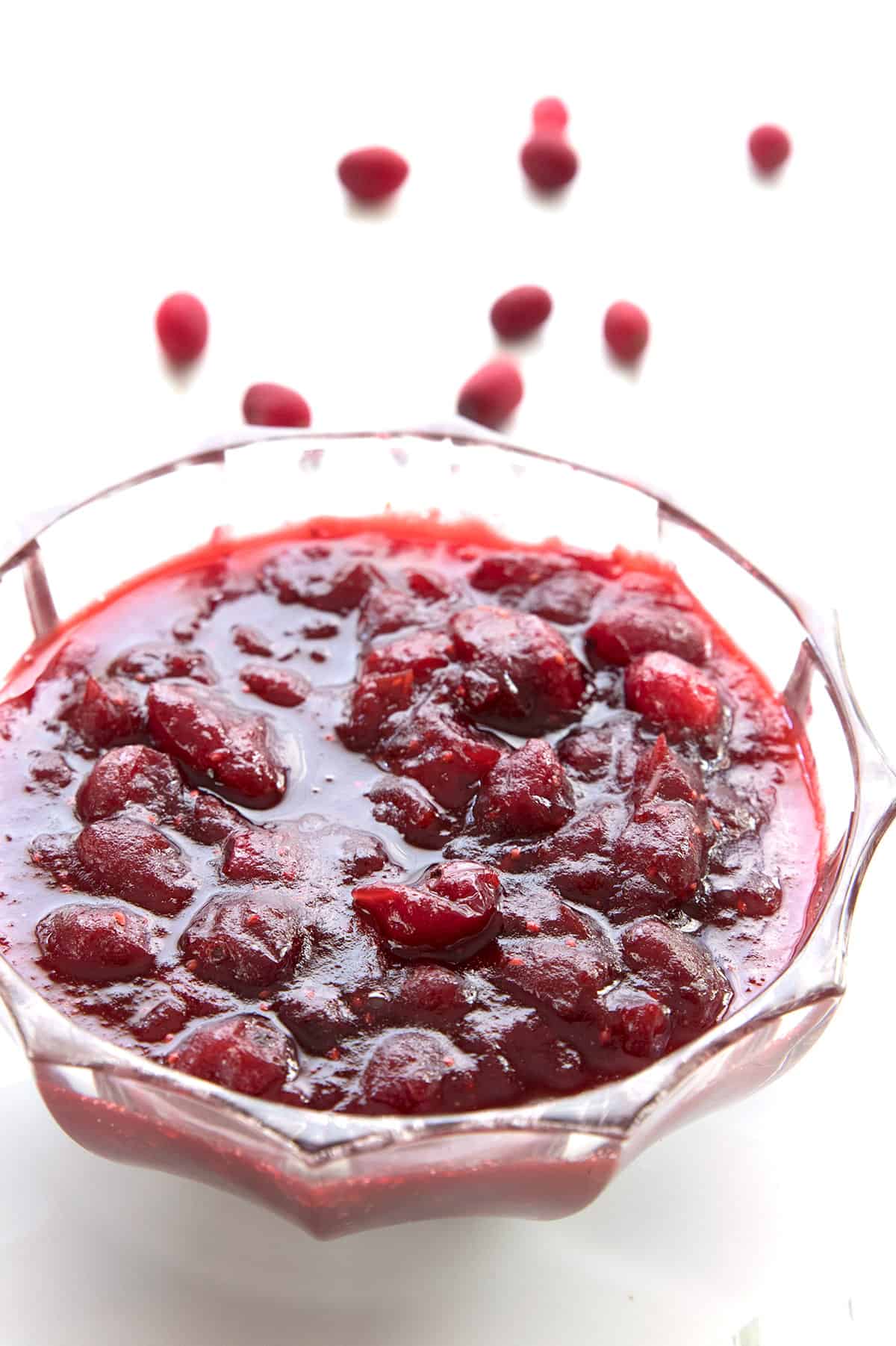 A cut crystal bowl filled with sugar free cranberry sauce.