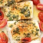 Titled image of a baking dish filled with baked halibut and roasted cherry tomatoes.