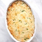 Top down image of Keto Shepherd's Pie in a white oval baking dish.