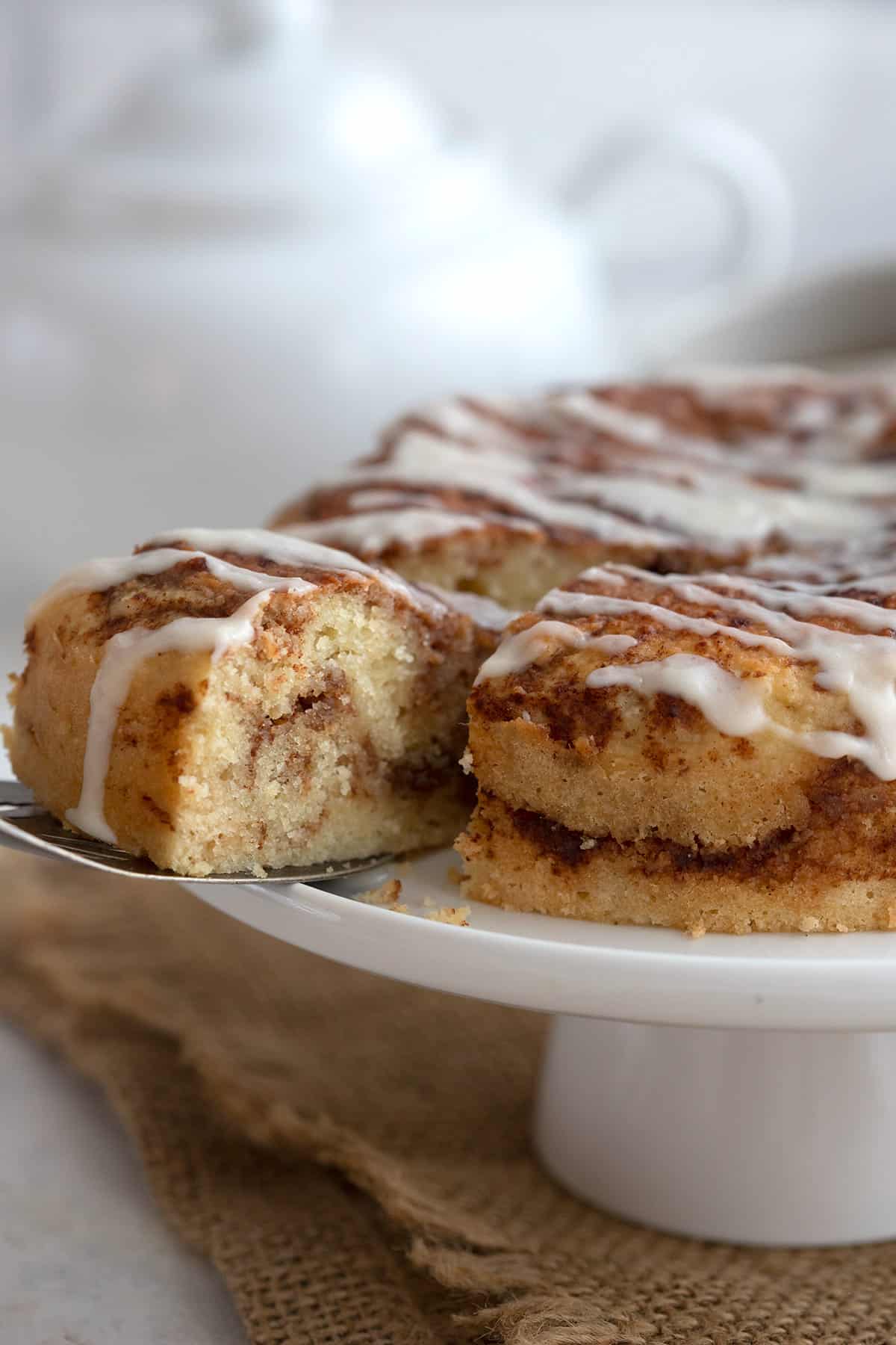 A slice of Keto Instant Pot Cinnamon Bread being lifted away with a cake lifter.