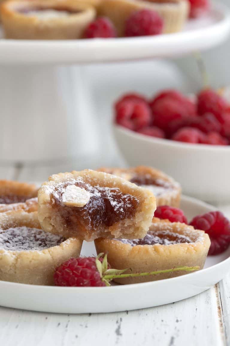 Keto jam tarts with a bite taken out of the top one.