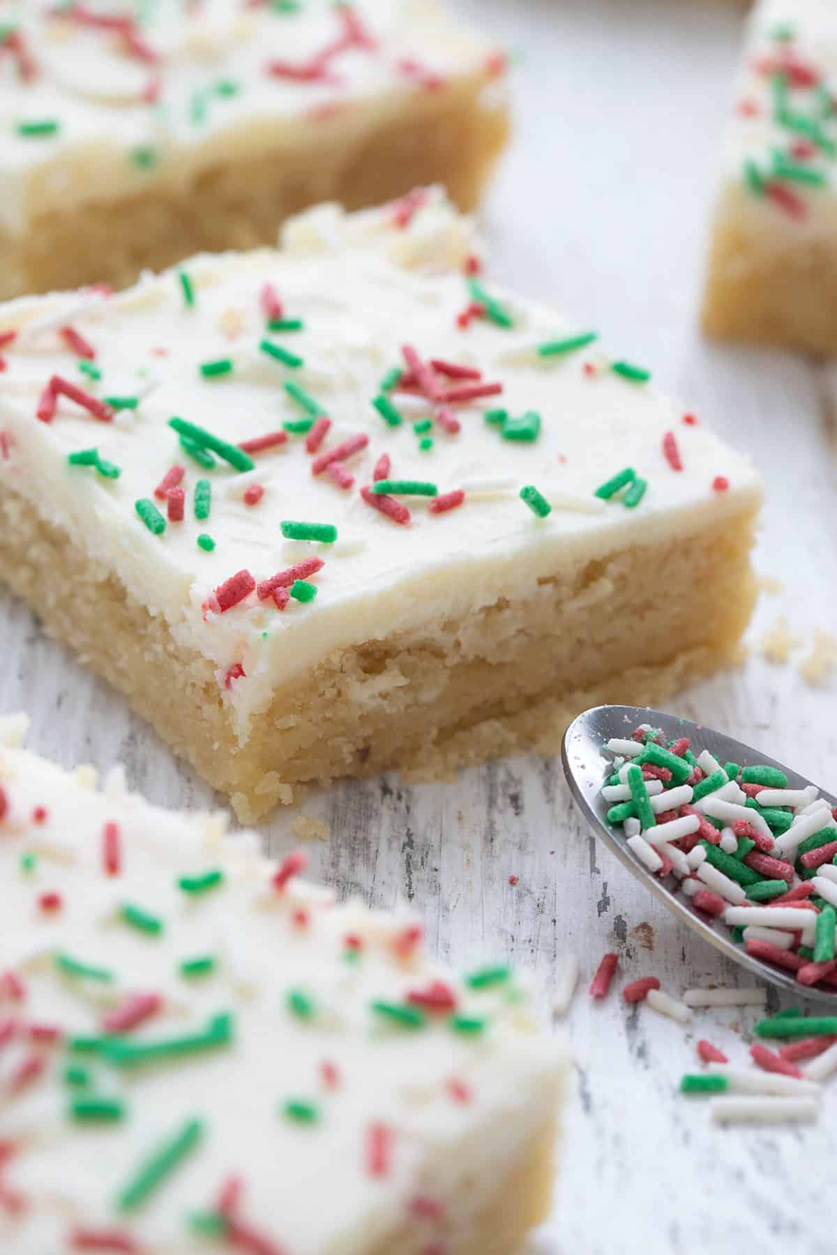 Close up shot of keto holiday cookie bars with green and red sprinkles.