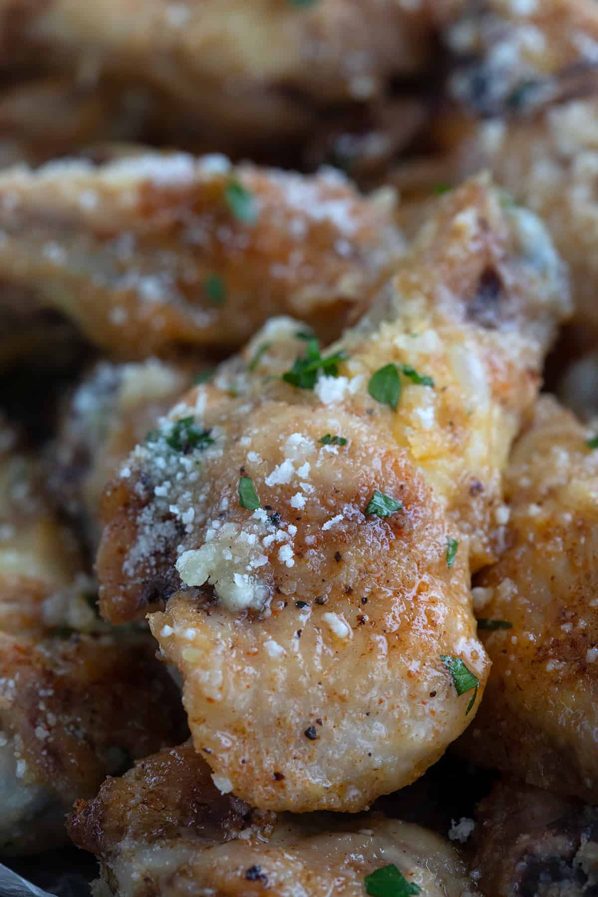 Close up shot of keto chicken wings with garlic and parmesan.