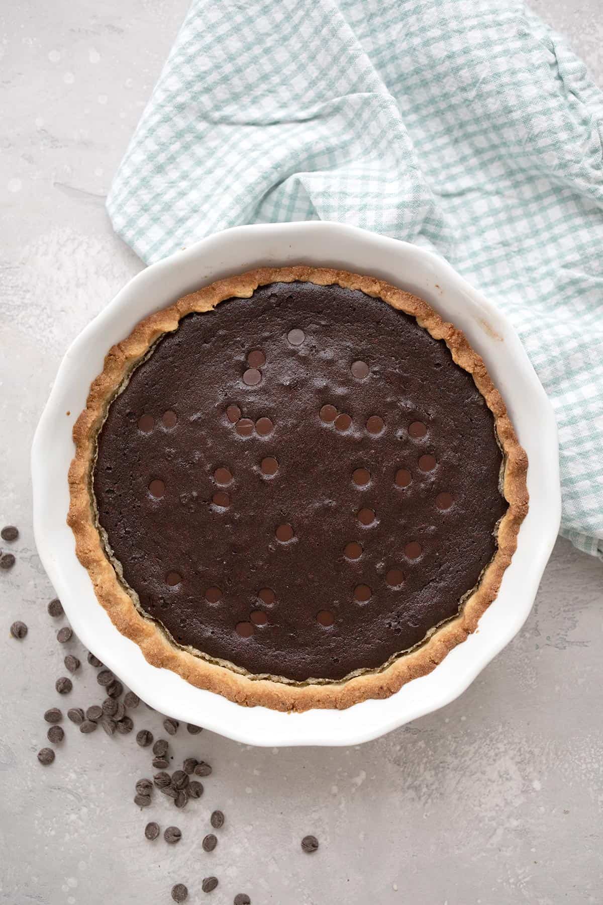 Top down image of keto brownie pie in a white pie pan.