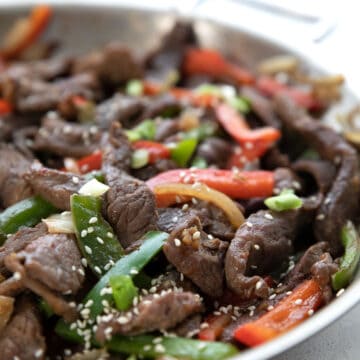 Close up shot of Chinese Pepper Steak in the pan.