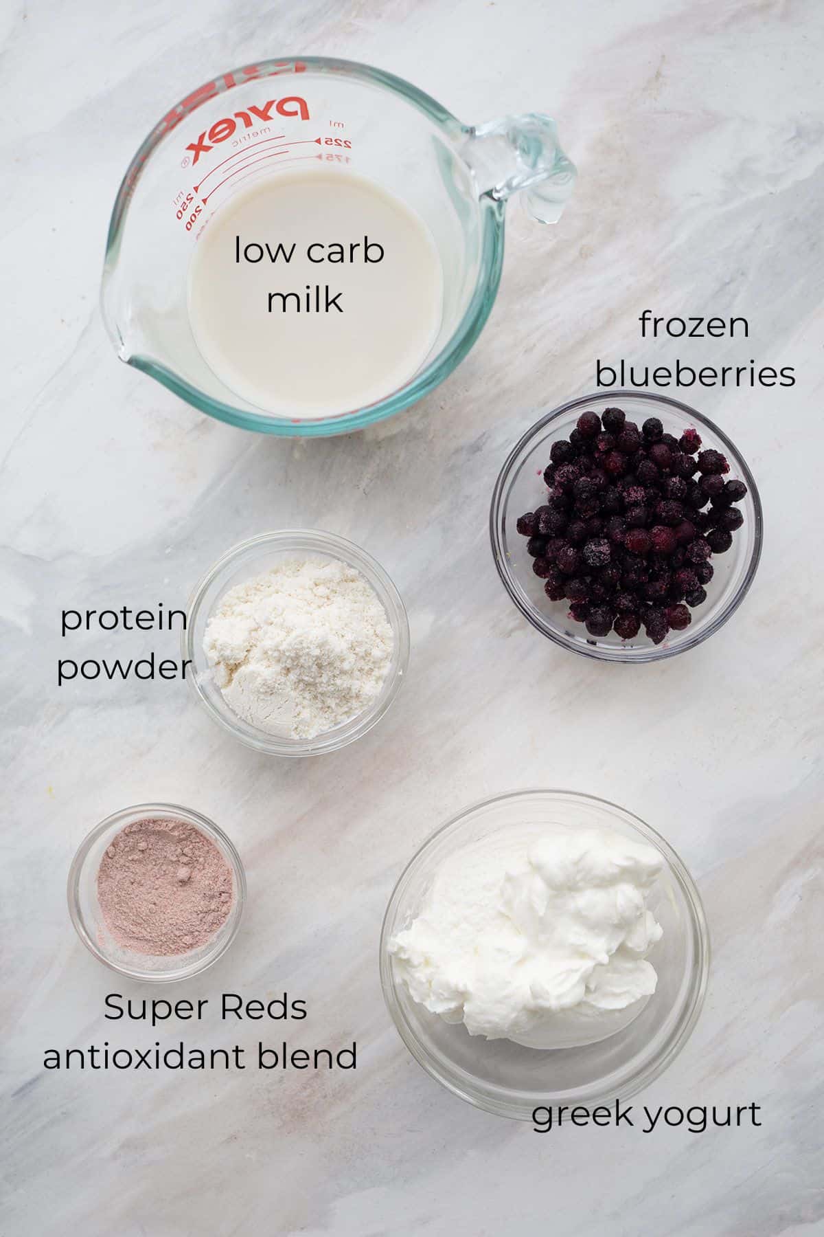 Top down image of ingredients needed for Keto Blueberry Smoothies.