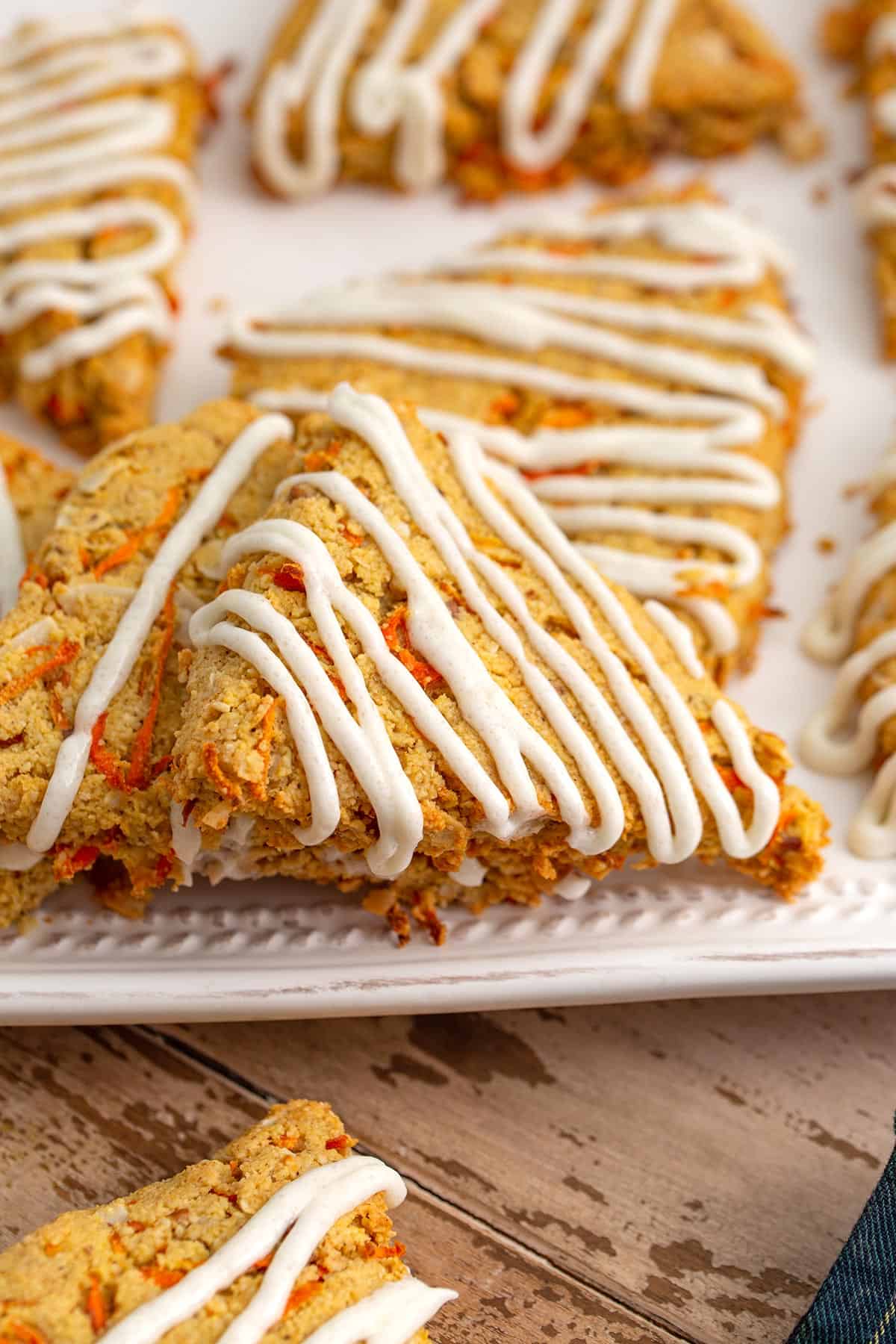 Close up shot of Carrot Cake Scones on a white tray.