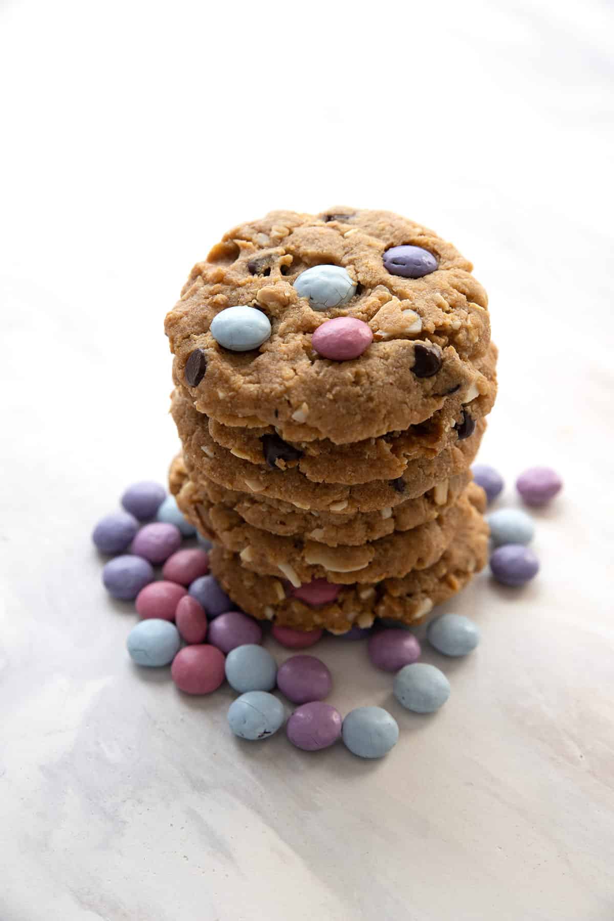 A stack of Keto Cookies with pastel candies around the base.