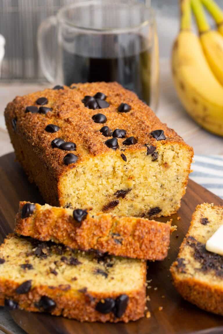 A loaf of keto banana bread with a few slices next to it