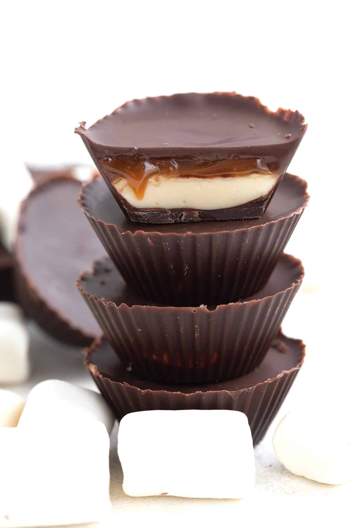 Close up shot of Keto Mallow Cups cut open to show the caramel dripping out.