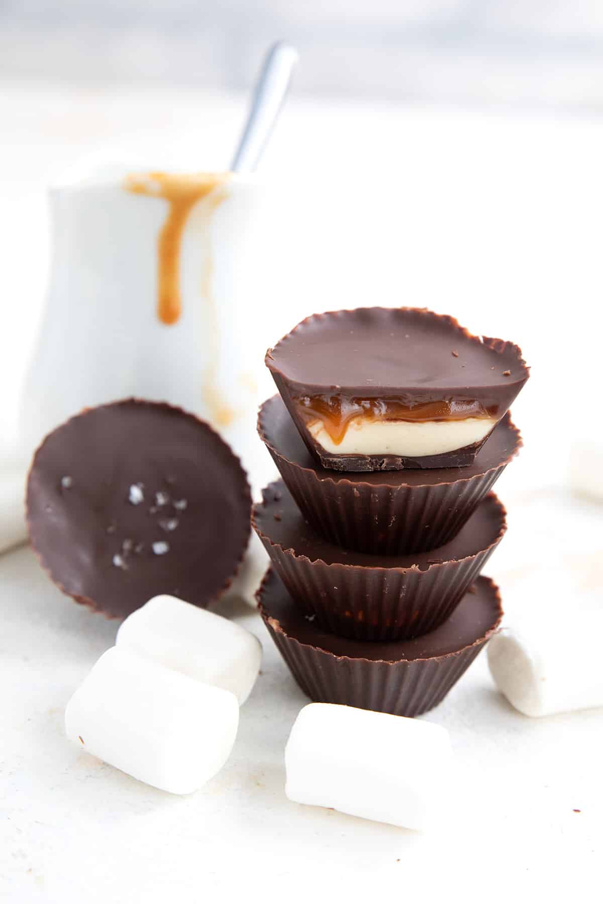 A stack of marshmallow and caramel filled Keto Cups.