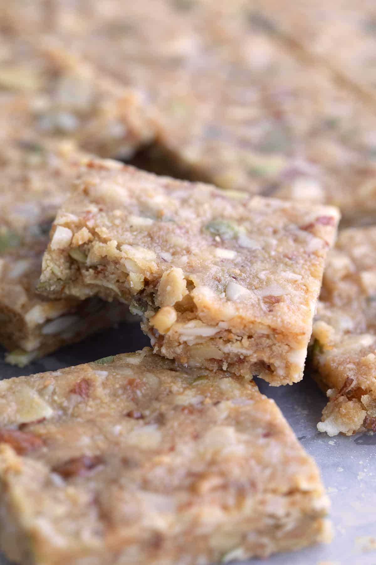 Close up shot of a low carb granola bar with a bite taken out of it.