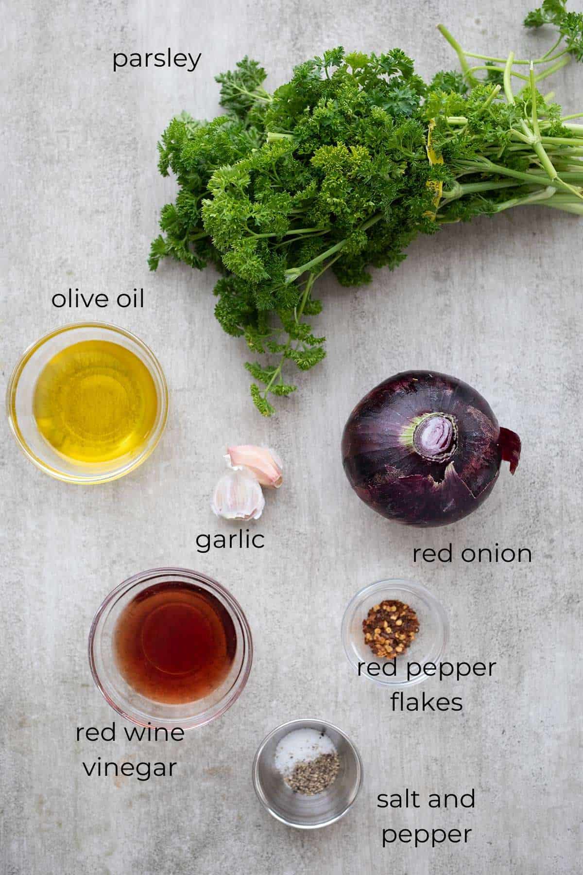 Top down image of ingredients needed for keto chimichurri.