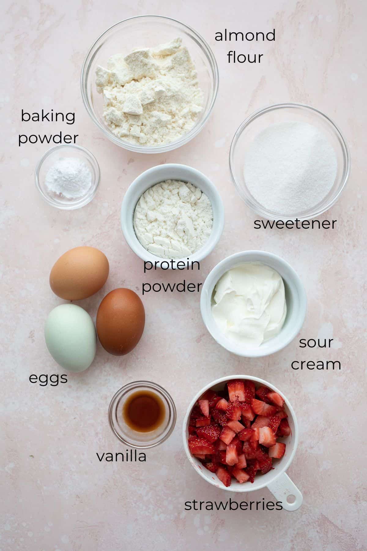 Top down image of ingredients needed for strawberry cupcakes.