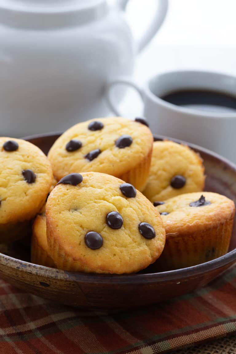 Keto Coconut Flour Banana Muffins in a brown bowl over a plaid napkin.