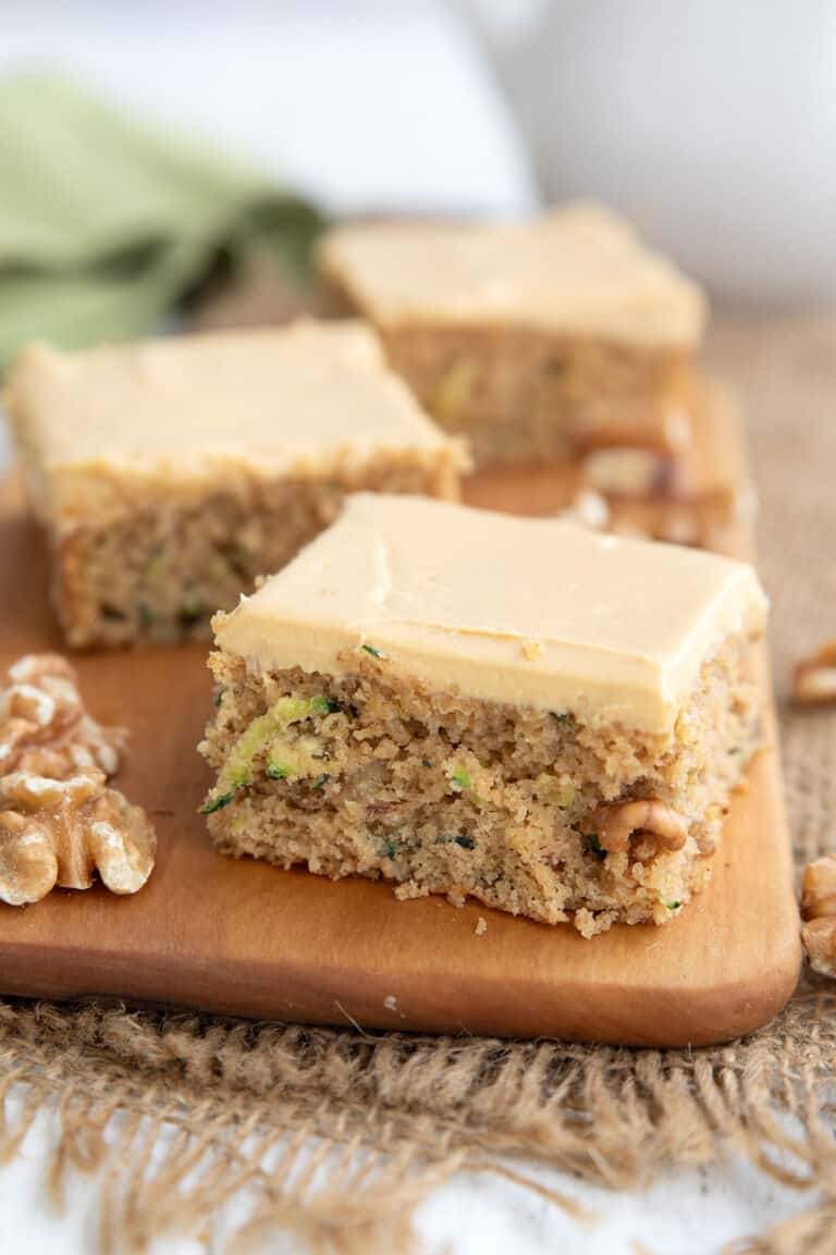 Keto Zucchini Bars on a wooden cutting board.