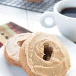 Titled image of two Keto Brown Butter Donuts on a white plate.