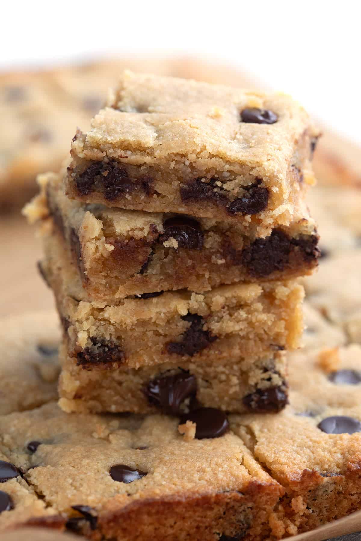 A stack of keto blondies with chocolate chips.