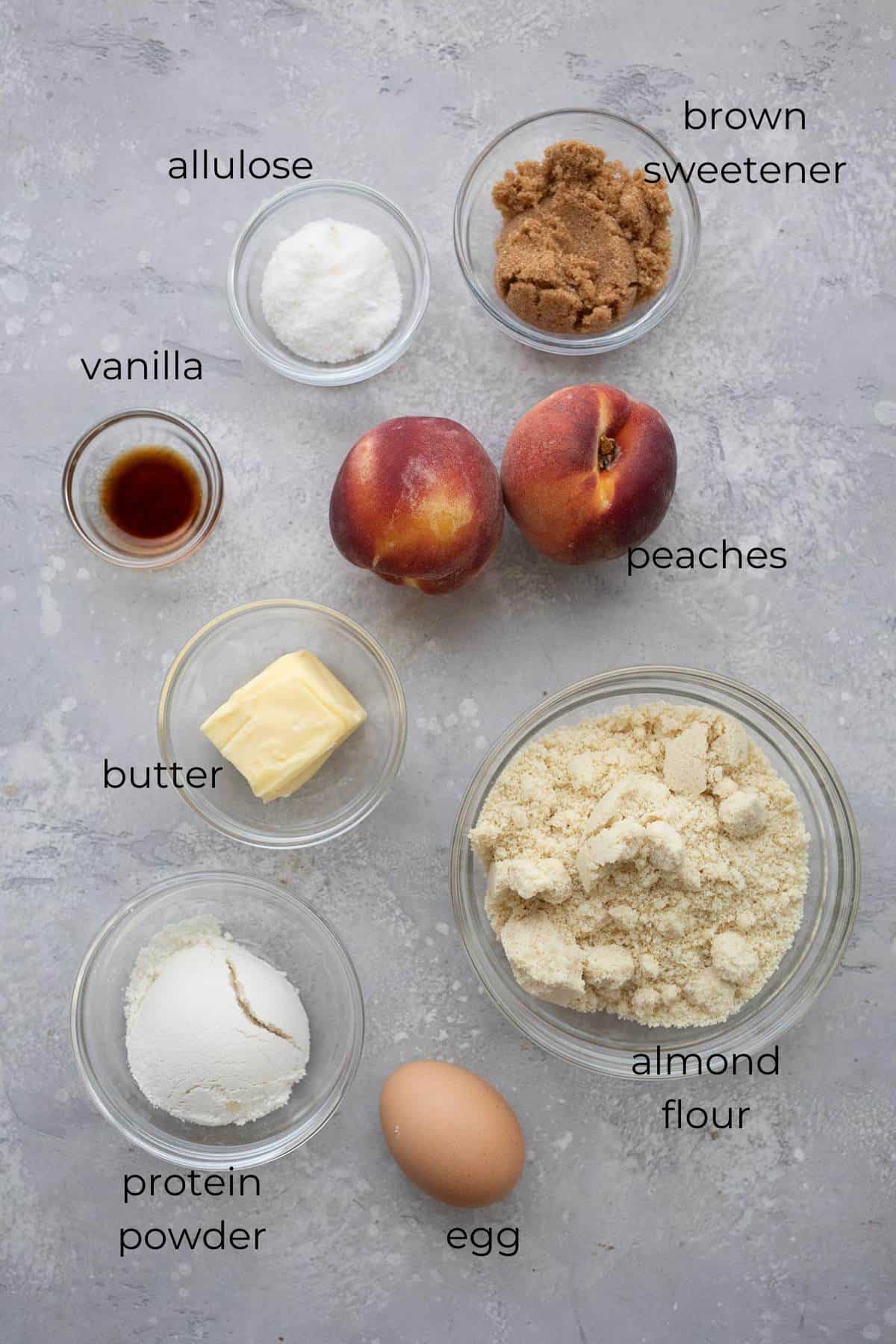 Top down image of ingredients needed for Keto Peach Upside Down Cakes.