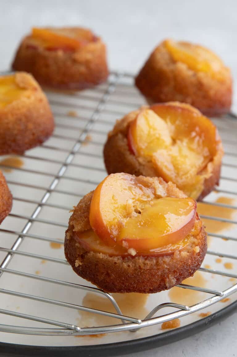 Keto Peach Upside Down Cakes cooling on a wire rack.