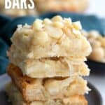 Tall Pinterest image of Keto Coconut Macadamia Bars with the title in white font at the top.